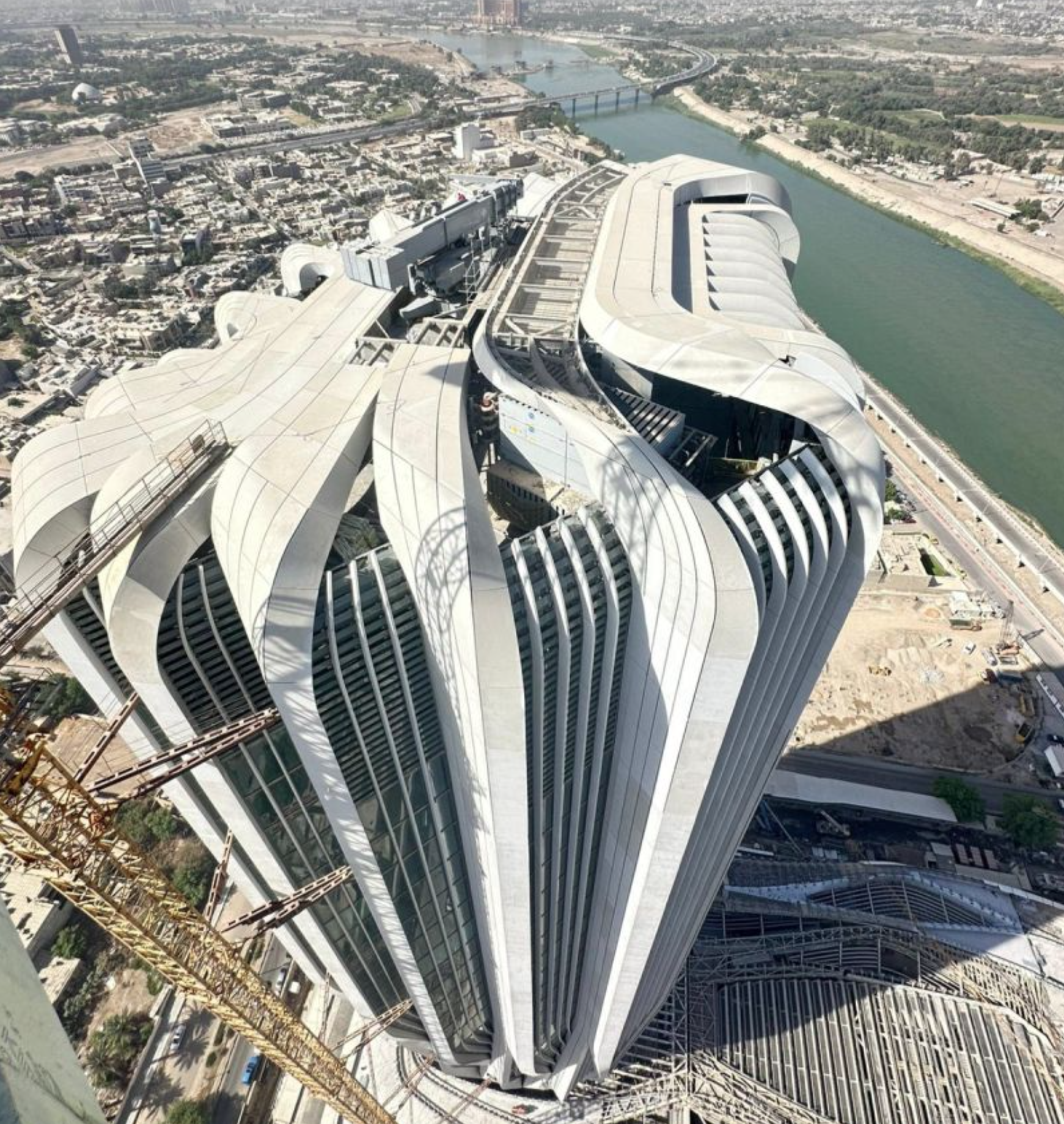 Aerial rendering of the Central Bank of Iraq tower, podium, and riverside setting
